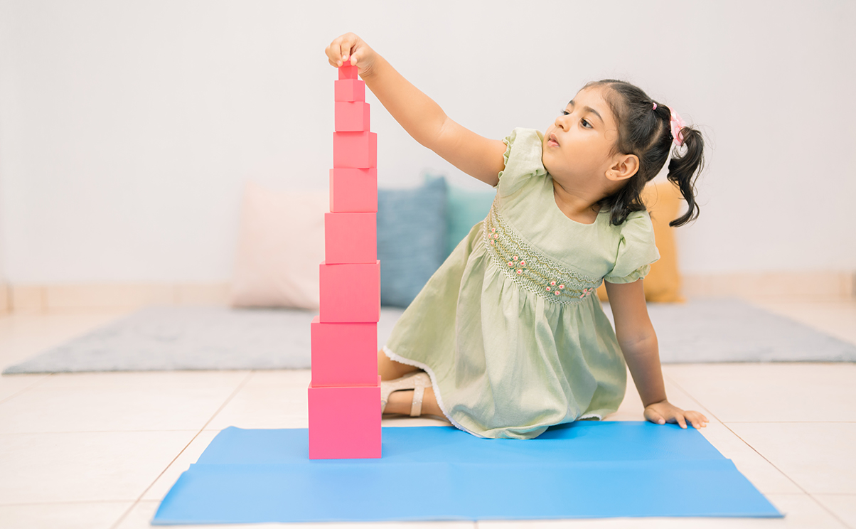 A child learning in the Montessori 1st Year classroom