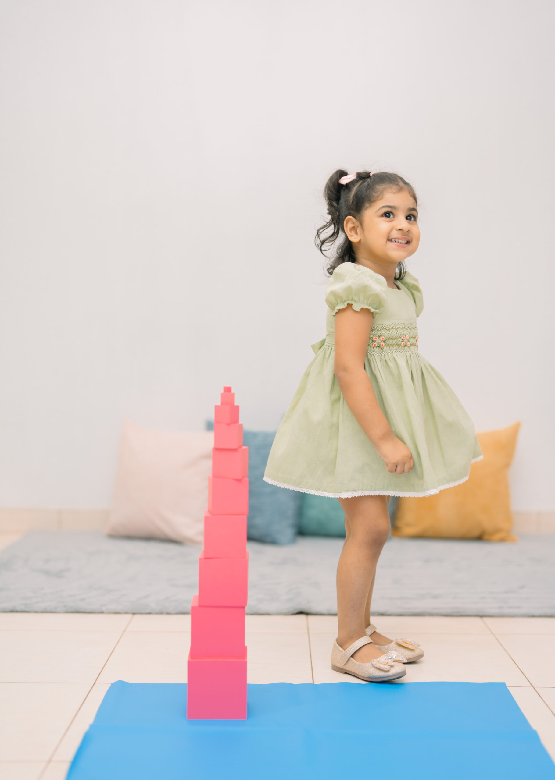 A child working with Montessori learning materials