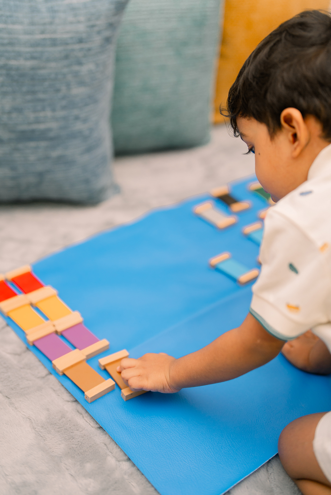 A child using Montessori learning materials