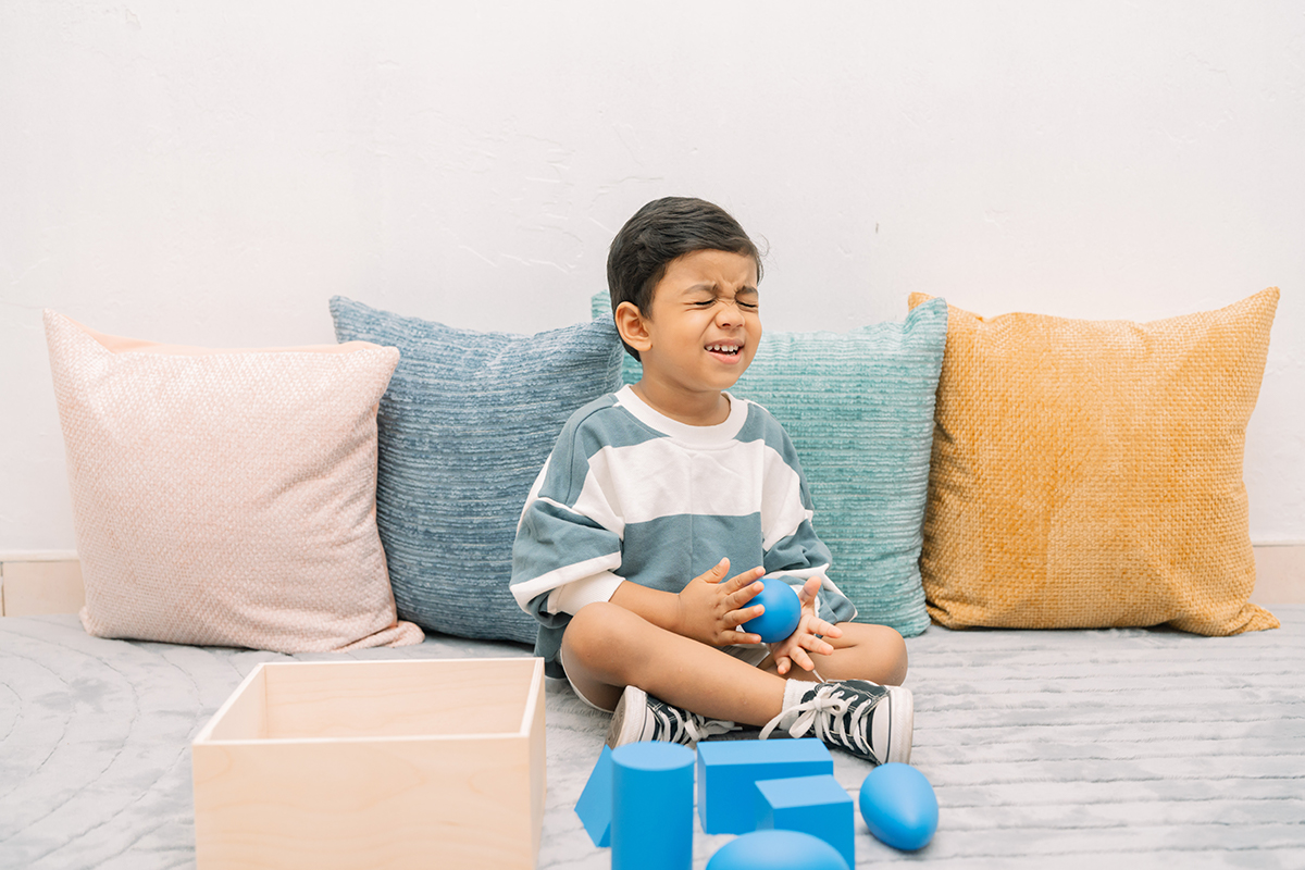 A child working with Montessori learning materials